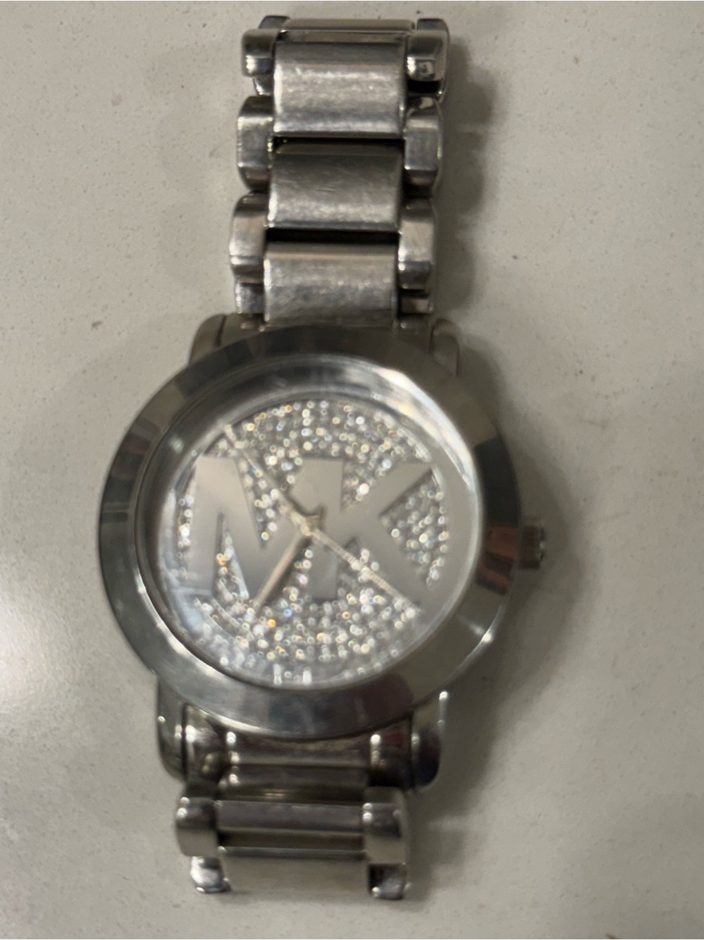 “Michael Kors MK3375 Silver Pave Crystal Logo Watch”